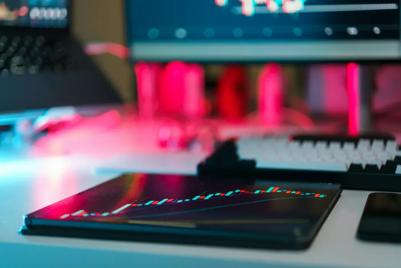 Keyboard and tablet lit by red and blue light