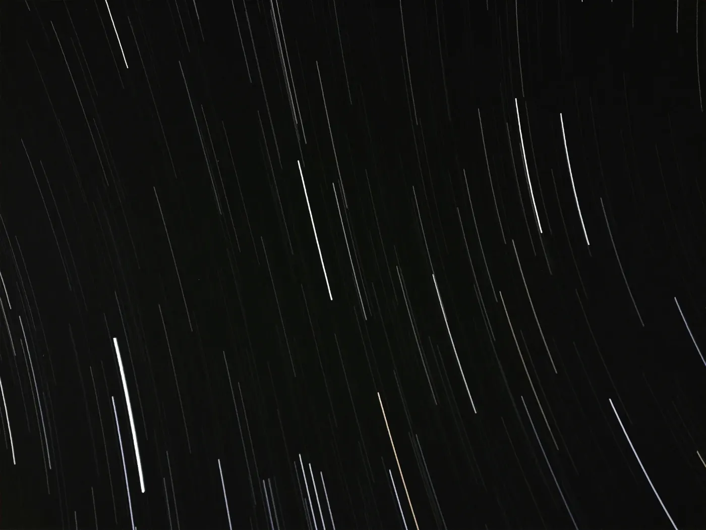 Long-exposure star trails against a dark sky